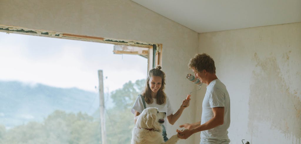 Couple with a dog remodeling home.