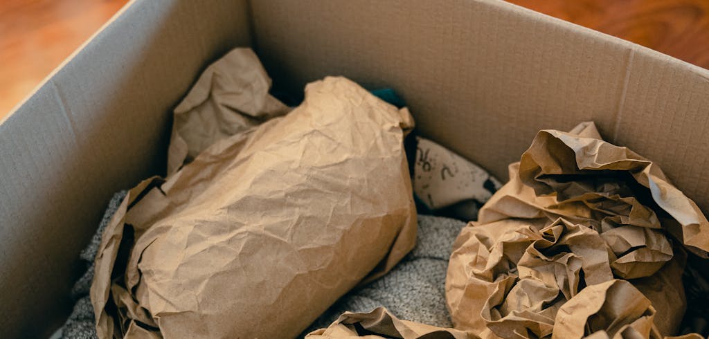 Packing a box with towls.