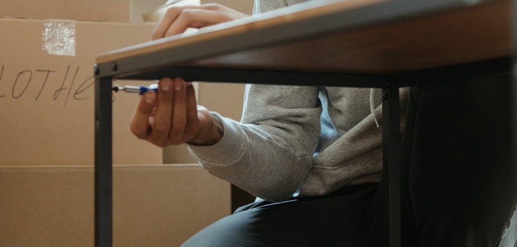 Man disassembling furniture.