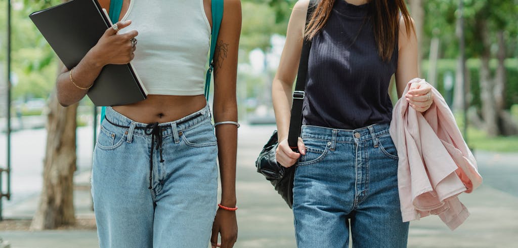Two women walking down a street.